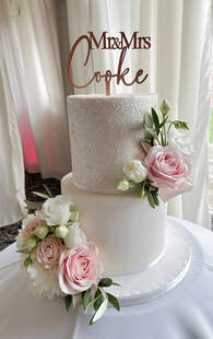 2 tier glitter wedding cake with beautiful fresh roses and peonies
